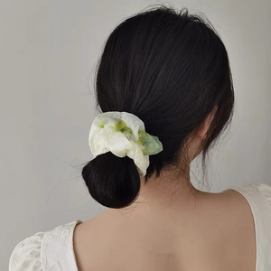 Floral tulle scrunchie with green and white organza design for elegant ponytail styling