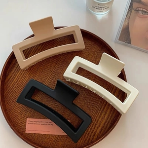 Three-piece large matte rectangle hair claws in khaki, cream, and black for thick hair