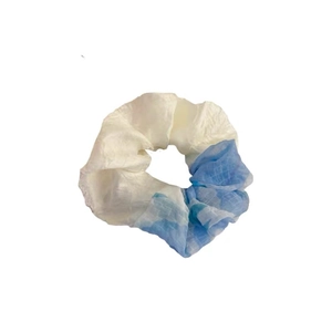Elegant blue and white patchwork mesh scrunchie with subtle plaid pattern and soft texture