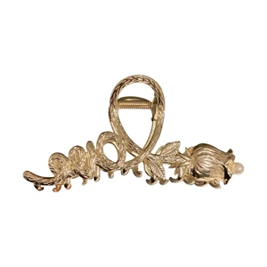 Elegant gold metal hair claw clip featuring 'Love' text and a pearl rose flower design