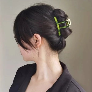 Elegant emerald green acetate claw clip with marble texture for French twist hairstyles