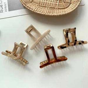 Set of four geometric acetate hair claws in marble and tortoiseshell patterns