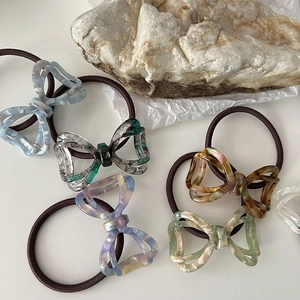 Set of five tortoiseshell and marble acetate bow hair ties on high-elastic bands