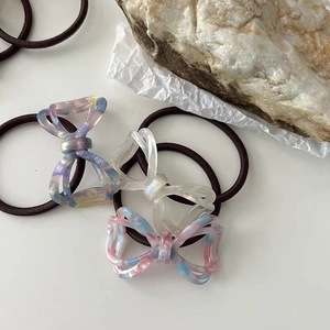Close-up of acetate bow hair ties with marble texture and high elasticity rubber bands