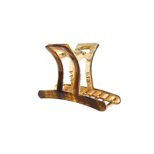Elegant tortoiseshell and gold metal claw clip for women featuring a minimalist geometric design