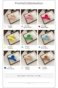 Detail view of large plush shark hair clips in nine colors on a wooden tray