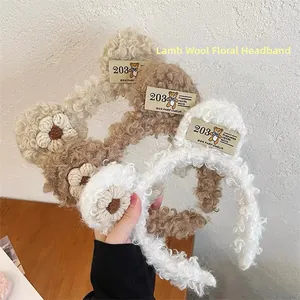 Detailed texture of fuzzy lamb wool headband with cute floral decor and bear patch
