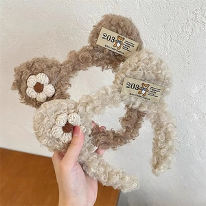 Plush bear hairbands in brown and beige colors with floral knit detail and retro fabric tags