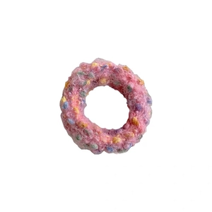 Pink knit hair scrunchie with colorful mini plush pom-poms for sweet autumn style