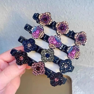Lot de quatre pinces à cheveux bec de canard ornées de fleurs en strass colorées