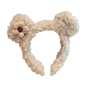 Creamy white plush headband with cute bear ears and crochet flower detail for face washing