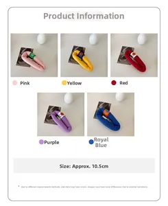 Detail showing colorful knit smiley hair clips in pink, yellow, red, purple and blue