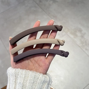 Three-piece set of matte banana hair clips in coffee, khaki and purple tones