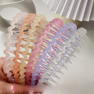Multi-color wavy frosted hairbands with fine teeth for secure grip in vibrant candy colors