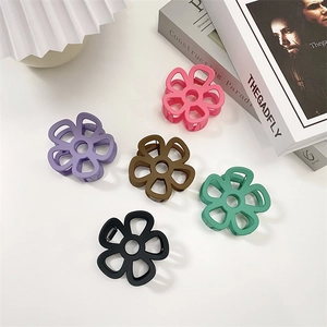 Elegant matte floral hair claws in five colors including pink, mint and black