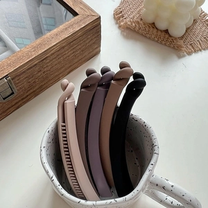 Minimalist matte banana hair clips in earth tones with stylish twist design set of five
