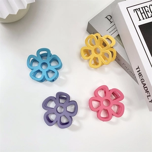 Macaron color flower hair claws in blue, yellow, purple, and pink matte finish