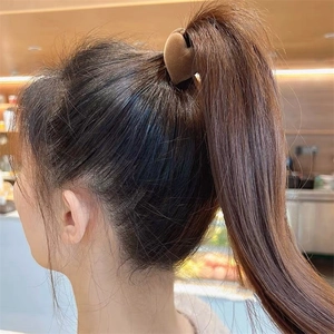 Brown flocked heart hair claw clip for high ponytail styling on brunette hair