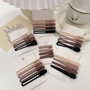 Close-up of matte Morandi earth tone hair clips set neatly arranged on a white card