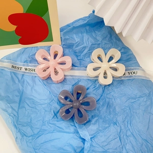 Floral medium hair claw clips in pink, beige and purple colors for women's hairstyling
