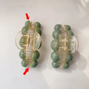 Detailed comparison of bead hair claw clips in morandi green with acrylic finish