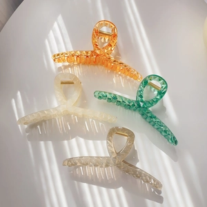 Set of four geometric crystal texture shark clips in orange cream green and gold colors