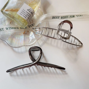Set of two minimalist large metal hair claws in shiny silver and gunmetal grey finishes