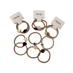 Minimalist 10-piece elastic hair band set with brown flower, heart, and smiley charms