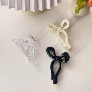 Three jelly ribbon bow claw clips in transparent, cream white and glossy black colors