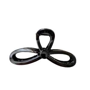 Minimalist glossy black hair claw clip with large butterfly hollow design for women