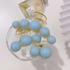 Elegant acrylic pearl hair claw clip with light blue spheres and yellow base for women