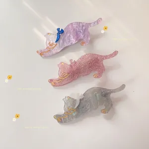 Cute acrylic cat hair clips in purple, pink, and grey with glitter texture and bows