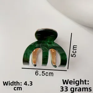 Detailed size guide for dark green marble acetate hair claw clip with golden base