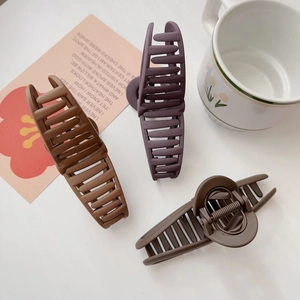 Three large matte finish hair claw clips in brown, purple, and khaki colors for long hair