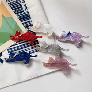 Set of six colorful cat hair clips in acetate finish with glitter and bow details