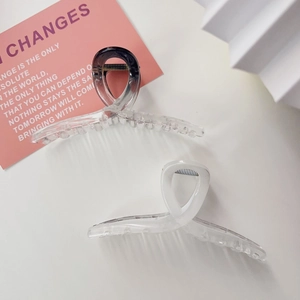 Minimalist large shark hair clips set in smoky black and frosted white resin finish
