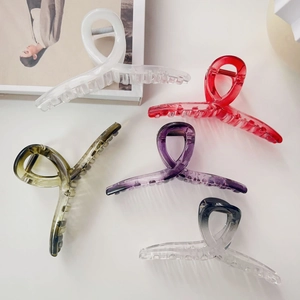 Collection of large acrylic hair claws in five colors with cross spiral design