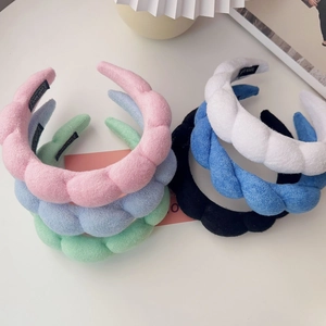 Thick twisted plush headbands in multiple colors like pink blue and green for women