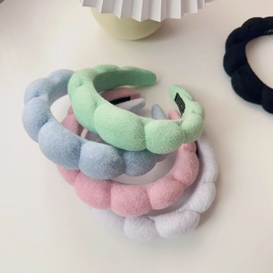Soft padded sponge headbands in pastel colors including mint green and powder pink