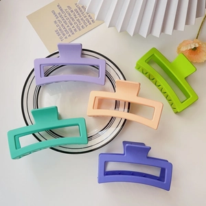 Detailed close-up of 13cm matte square shark hair clips in five vibrant pastel colors