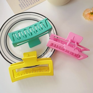 Three large matte square shark hair clips in mint, pink, and yellow for thick hair