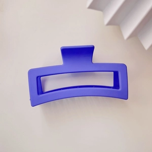 Macro detail of large 13cm matte Klein blue square hair claw clip for thick hair