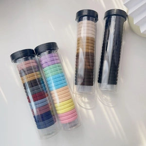 Nahtlose, hochelastische bunte Haargummis im Set mit vier transparenten Aufbewahrungsrohren