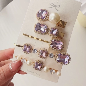 Detailed set of five purple crystal and pearl hairpins with elegant gold alloy bases