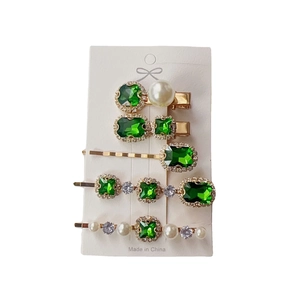 5-piece vintage emerald rhinestone and pearl hair clip set on a white display card