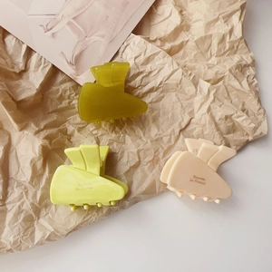 French style acetate jelly hair clips in green yellow and beige on vintage paper
