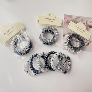 Black and white spiral telephone wire hair ties set with trendy patterns and heart motifs