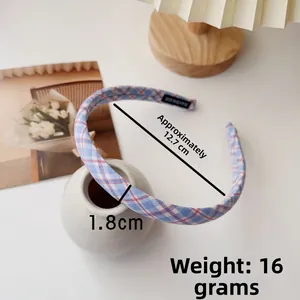 Detail shot of blue and pink plaid headband showing 1.8cm width and 12.7cm diameter dimensions