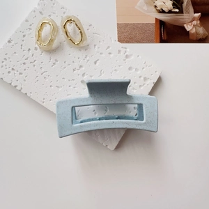 Detailed view of large Morandi blue rectangle hair claw clip with ink splatter texture