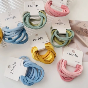 Detailed view of elastic hair tie set on paper card showing high density woven texture